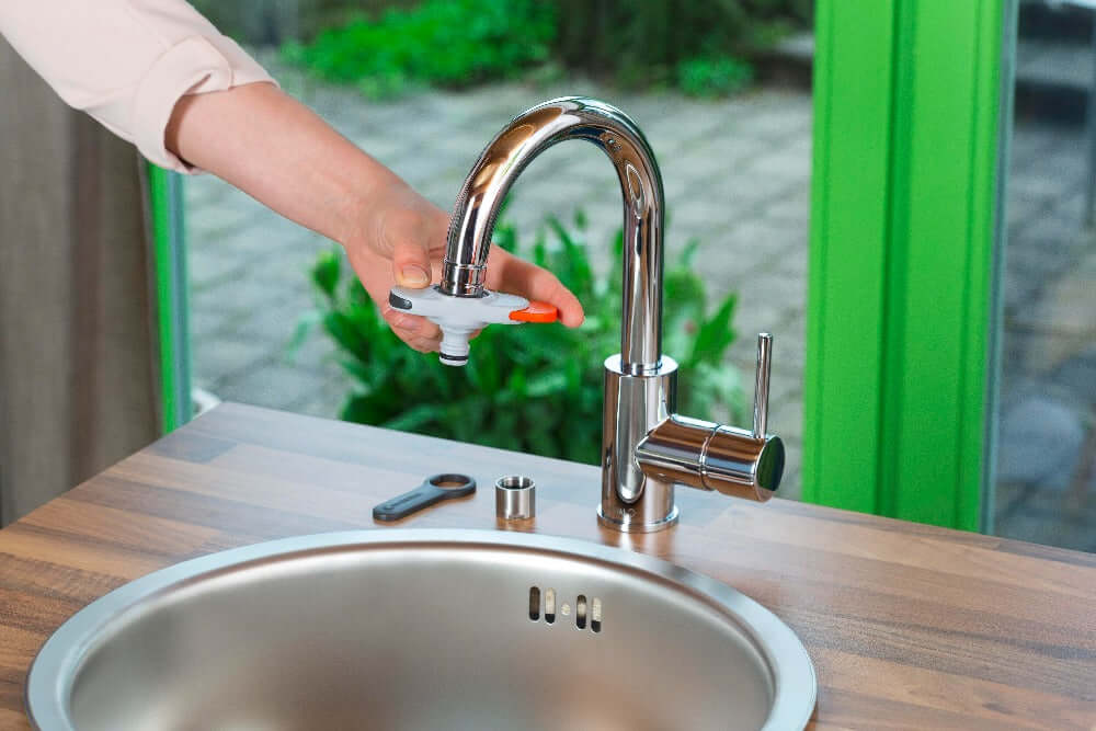 Gardena indoor tap connector attached to kitchen tap