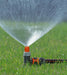 Classic sprinkler in use on lawn